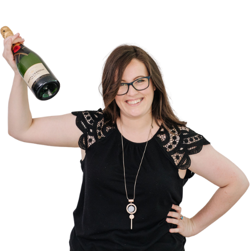 Leanne Woff holding champagne for the OBM Challenge